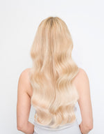 Long, wavy blonde hair wearing Bohemian Blonde 