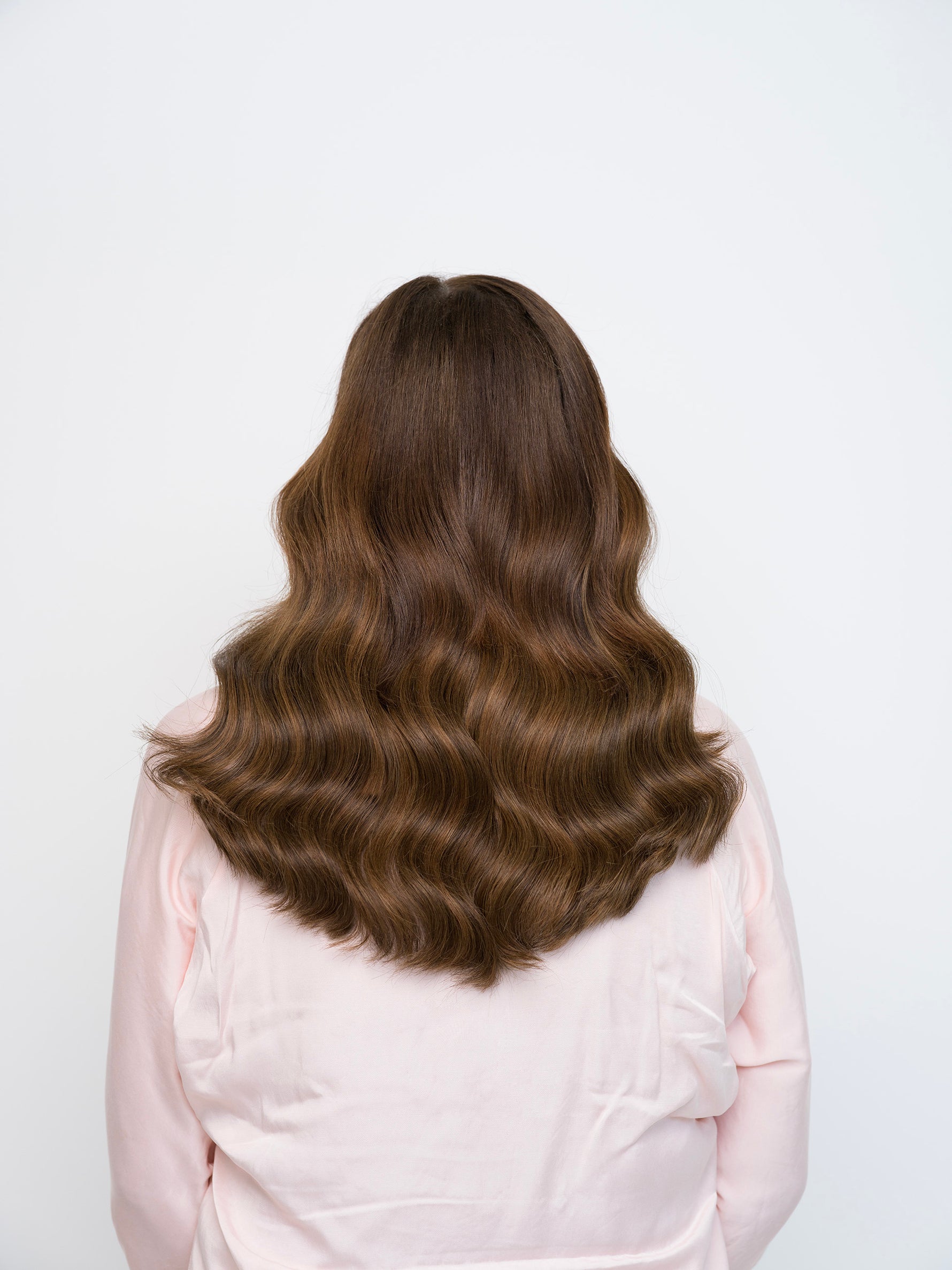 Long wavy hair in rich dark brown tones styled to showcase Extra Hair Extension Piece - Dark Brown Mix 