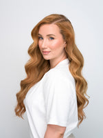 Woman with long wavy auburn hair modeling the Extra Hair Extension Piece - Auburn 