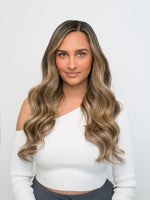 Woman with long, wavy hair in a dark brown and blonde mix wearing Extra Hair Extension Piece - Dark Brown & Blonde Mix 