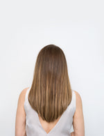 Back view of woman with smooth, straight brown hair showcasing Extra Hair Extension Piece - 