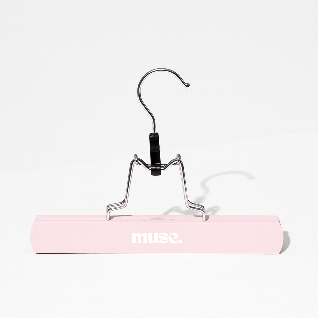 Hair Extension Hanger with pink wooden base and metal hook, designed for organizing hair extensions neatly and securely