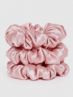 Satin Scrunchie Set featuring soft, smooth light pink satin fabric scrunchies stacked neatly for gentle hair styling.